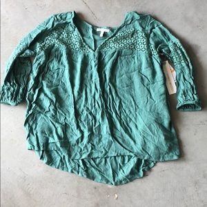 O’Neill loose fitting high low top. NWT